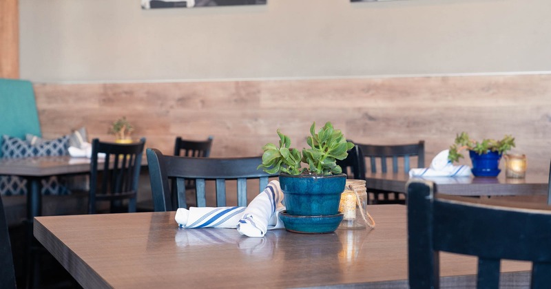 Interior, tables and chairs in dining area