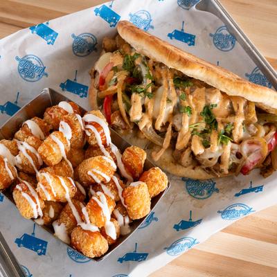 Grilled chicken sandwich and tater tots.