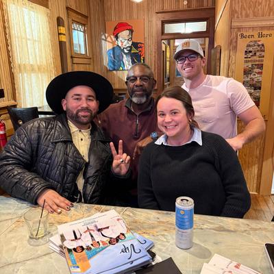 A group of friends posing for a photo.