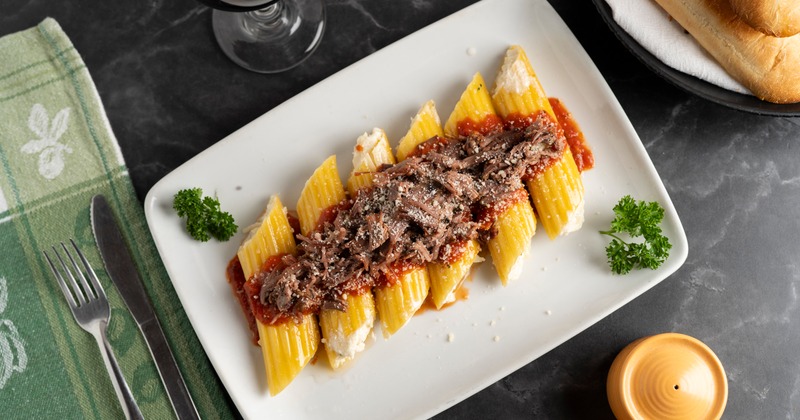 Cheese stuffed rigatoni, topped with beef