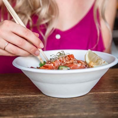 Person eating fish salad