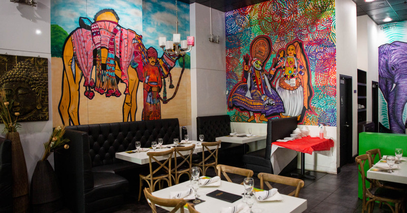 Decorated interior, tables with cutlery and glasses