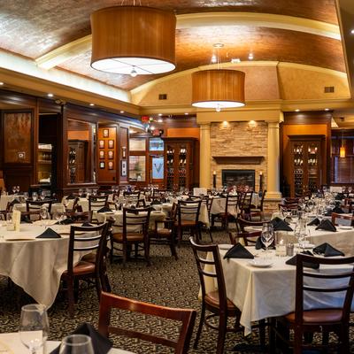 Diner room, tables, chairs, fireplace behind