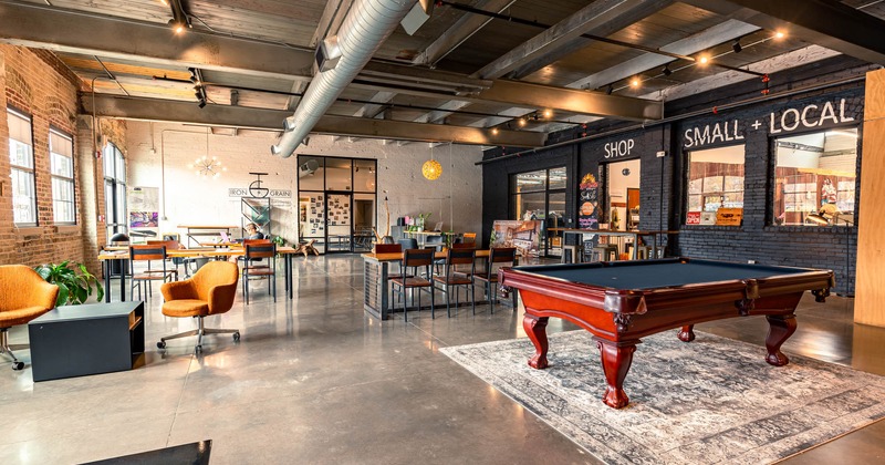 Interior, tables, chairs, pool table, windows, ventilation system on the ceiling