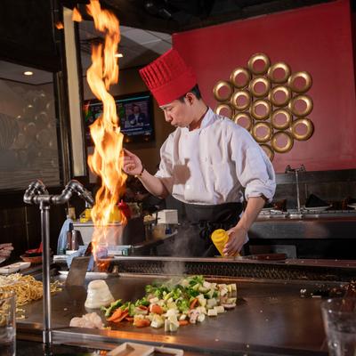 Hibachi chef preparing food.