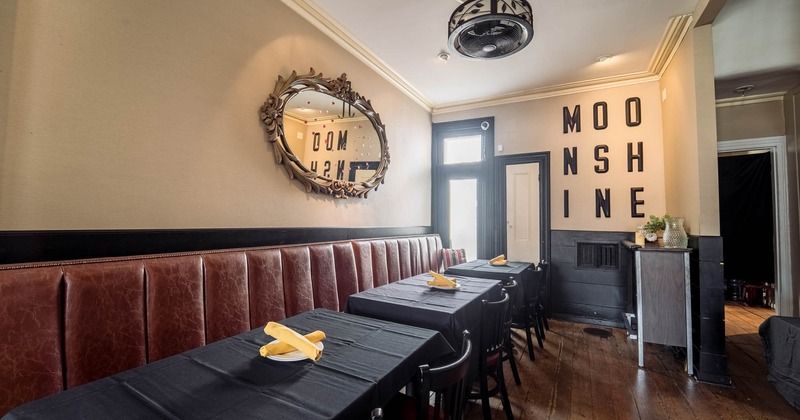 Interior, tables, chairs and wall mounted benches lined up