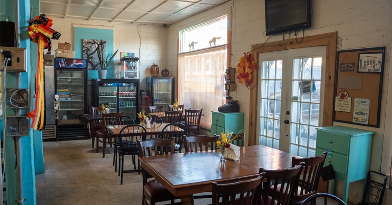 Dining area with wooden tables and chairs
