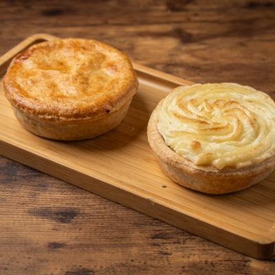 Pies on a wooden board.