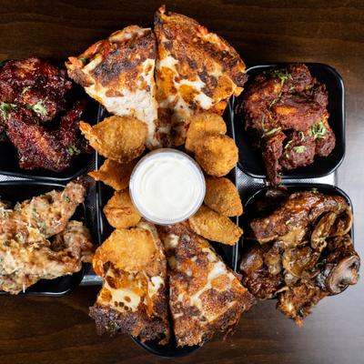 Appetizer Platter with wings, tenders, shrimp, quesadilla and jalapeno poppers.