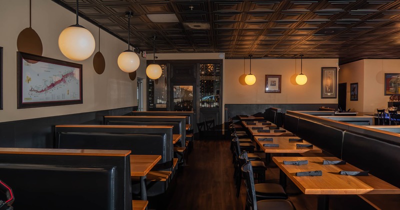 Interior, booths on the left, tables with chairs on the right