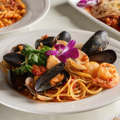 Seafood Chitarra featuring mussels, shrimp, and clams served over pasta.