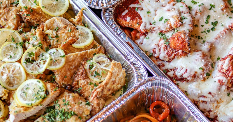 Assorted catering food trays, top view, close up