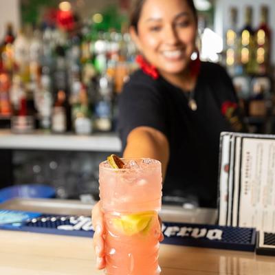 A person serving a beverage.