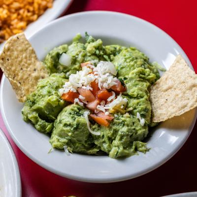 Served chips with guacamole.