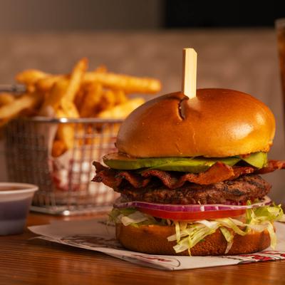 Cali burger with avocado, bacon, lettuce, tomato, and red onion.