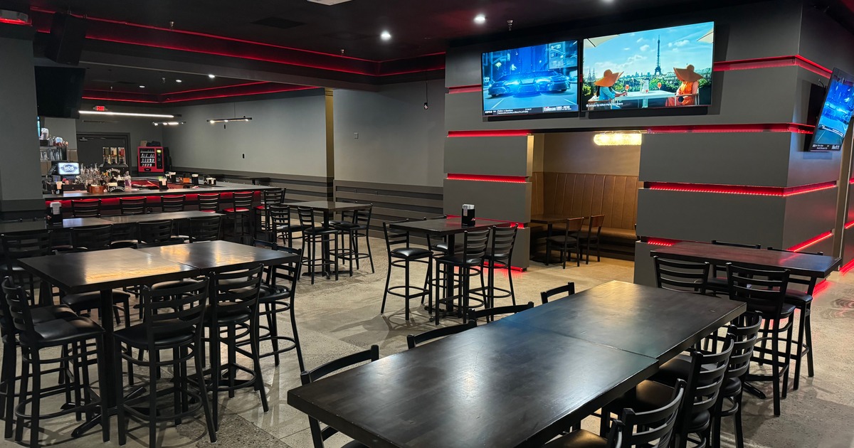 Interior with dining tables, chairs, and countertop seating