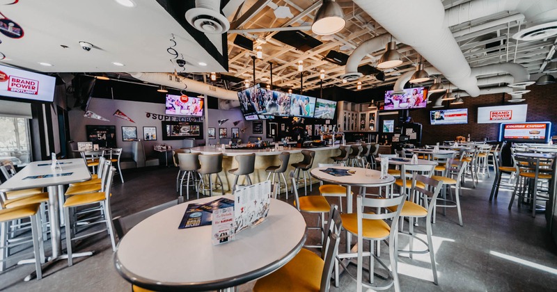 Interior, wide view, tables and chairs ready for guests