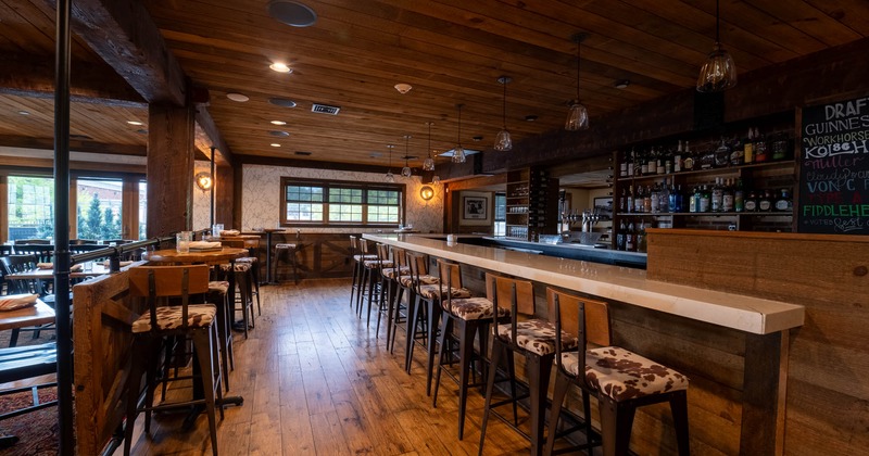 Bar area, tall tables and bar stools