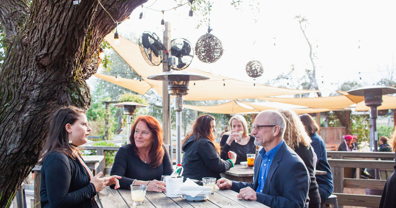 Exterior, guests sitting at a table