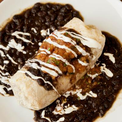 Served burrito in the plate.