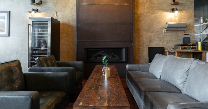 Interior, coffee table, leather sofa and two armchairs