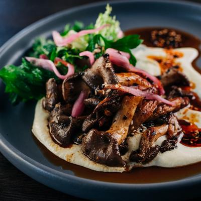 Grilled Mushrooms, Leek + Tofu Soubise, Salsa Macha, Pickled Ramps, Cilantro, Parsley GF, Vegan.