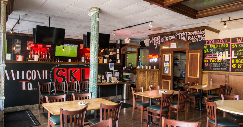 Interior, dining area and checkout counter in the back
