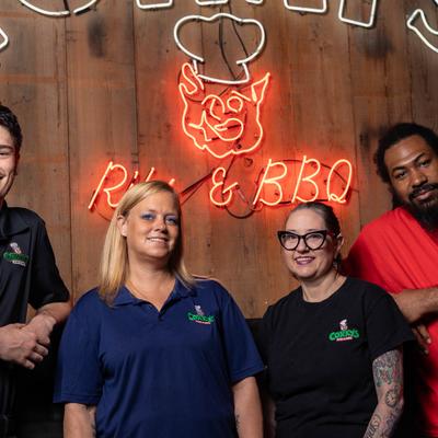 The restaurant stuff posing for a photo.