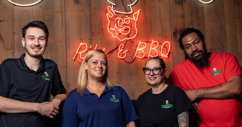 The restaurant stuff posing for a photo