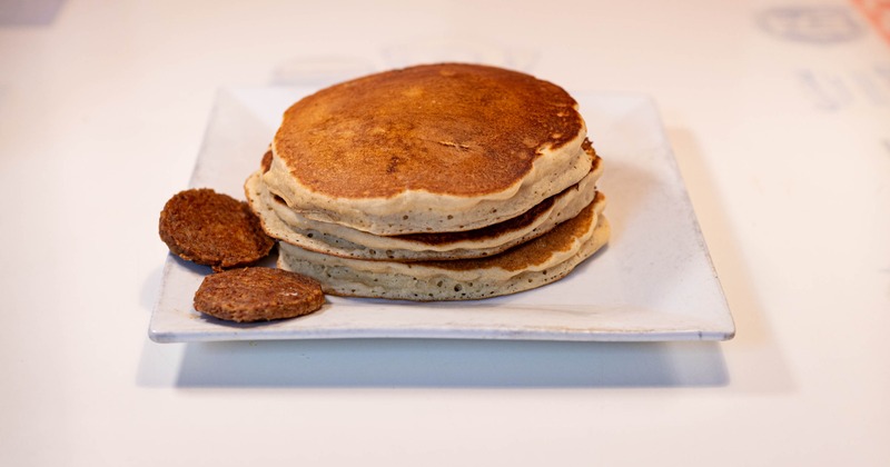 Pancake stack served with two sausage patties