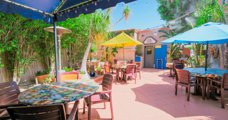 Interior, tables for four ready for guests
