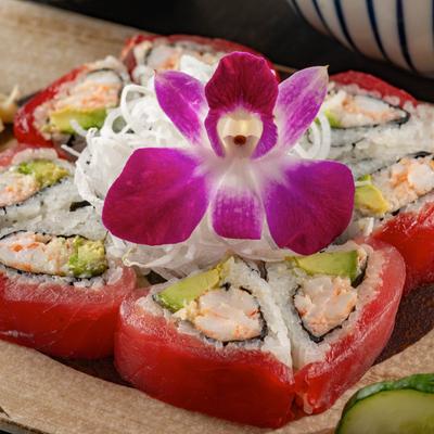 Sweet Heart Roll with tuna, shrimp, and avocado, garnished with a flower.