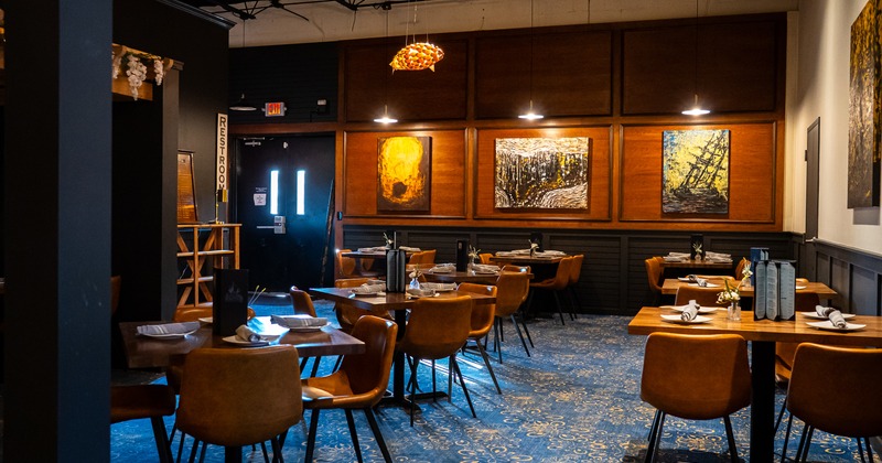 Modern style of dining area interior design with set tables