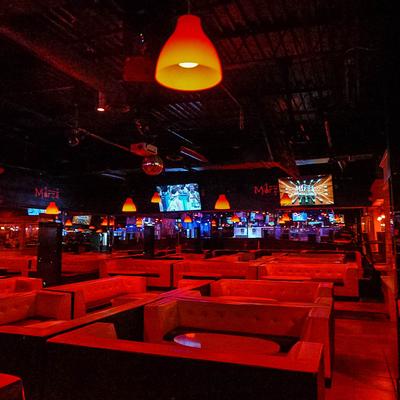 Seating area, red lighting.