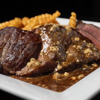 Steak frites plate, close up.