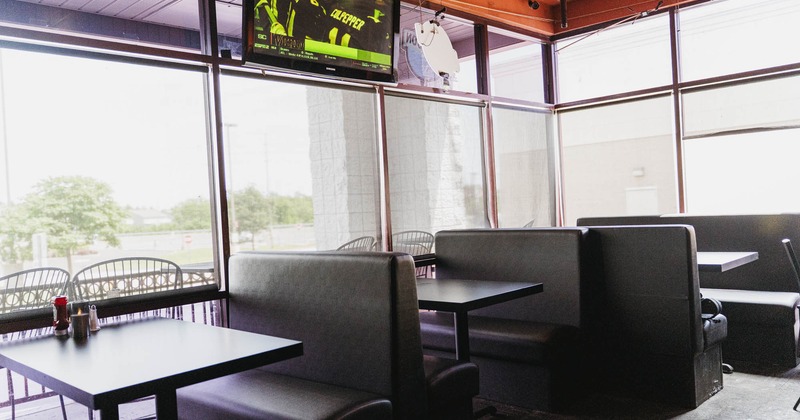 Restaurant booths placed next to large windows