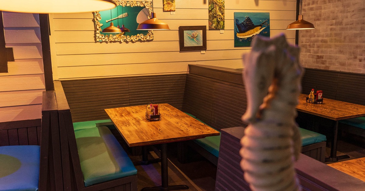 Interior, table and benches with blue leather cushion