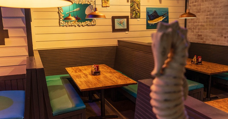 Interior, table and benches with blue leather cushion