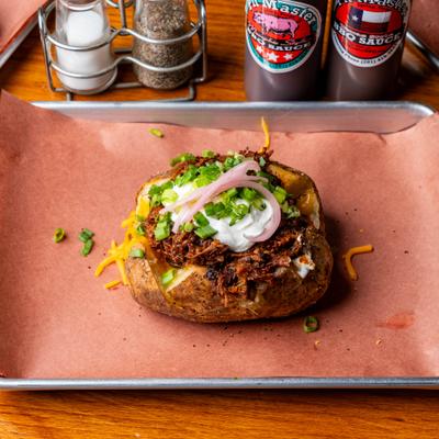 Chopped brisket stuffed potato.