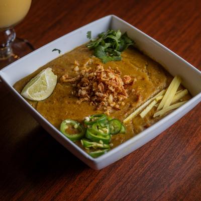 Spicy porridge of slow cooked grains and meat.