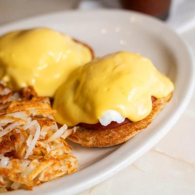 Eggs Benedict with hash brown.