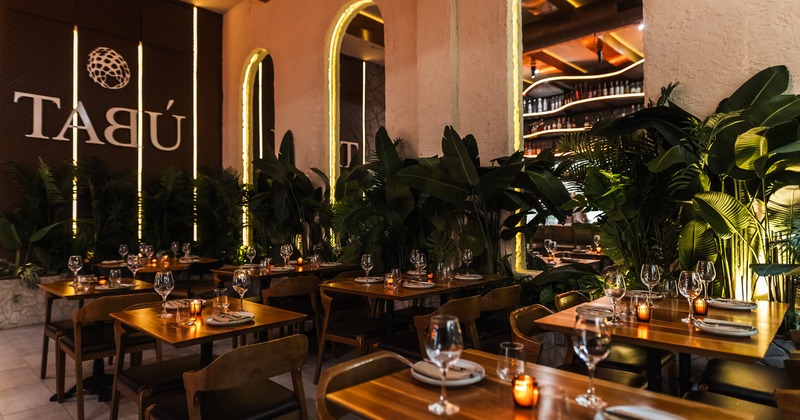 Nicely designed upscale restaurant interior dining area with set tables