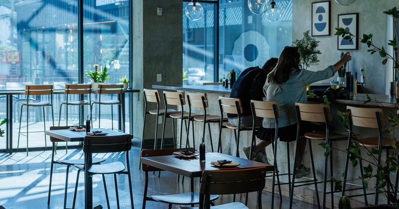 Diner tables and chairs,  bar behind