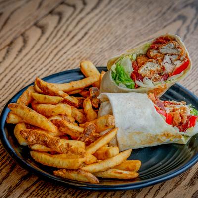 Honey Chicken Roll - Up served with a side of french fries.