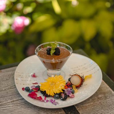 Chocolate Mousse garnished with fresh berries and flowers.