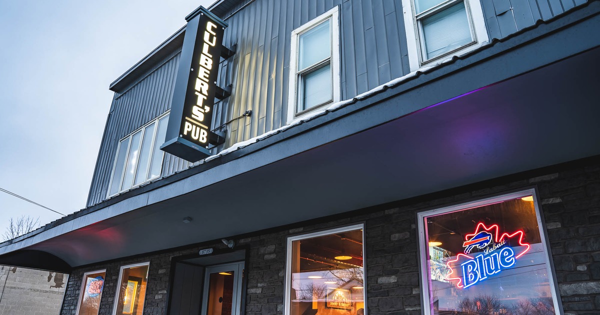 Exterior, entrance to restaurant and sign above