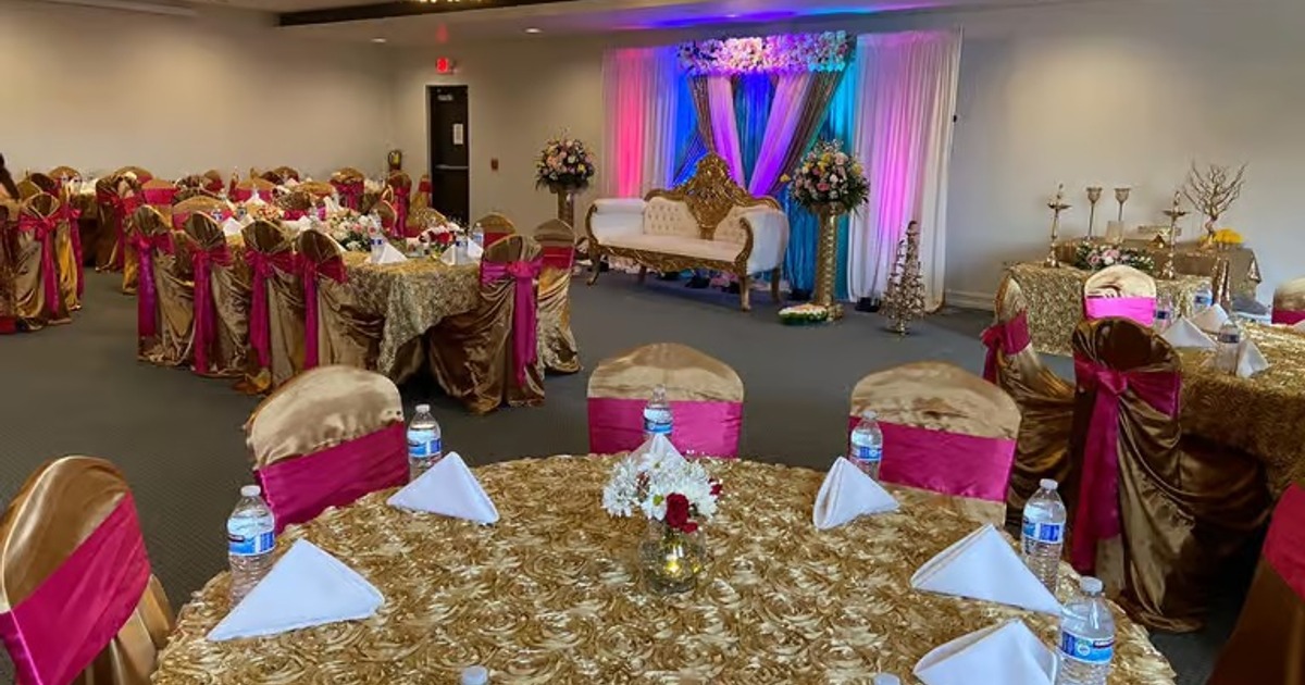 An elegantly decorated banquet hall set up for a formal event or celebration