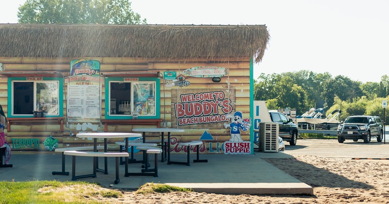 Picnic tables in front of buddy's beach bungalow