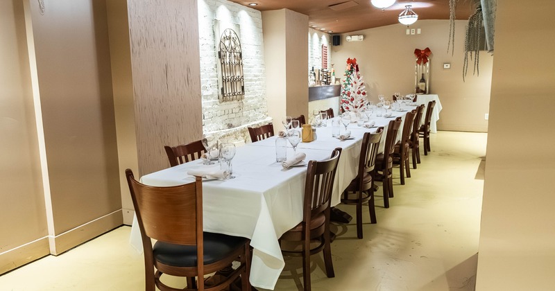 Interior, long table ready for guests