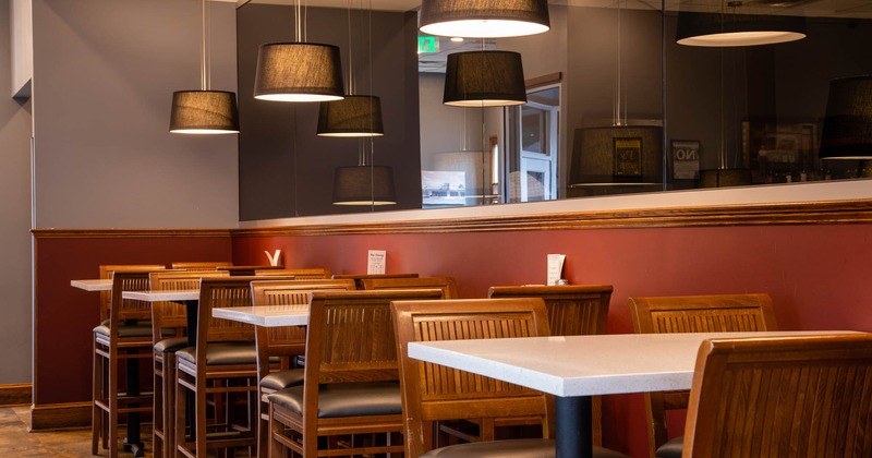 Interior, lined up tables and chairs